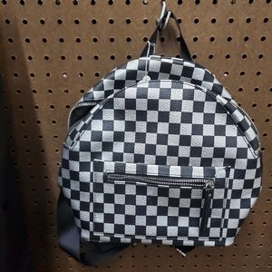 Black and silver mini backpack.